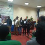 Law Student Win Trophy photo with Prof. Nigussie Dechassa