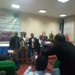 Law Student with Professor Nigusie hold cup group photo Law Student with Professor Nigusie hold cup group photo