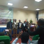 Law Student with Professor Nigusie hold cup group photo Law Student with Professor Nigusie hold cup group photo