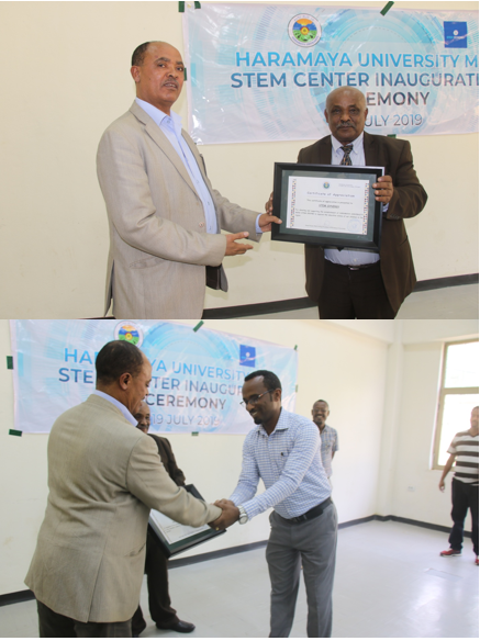 Prof. Kebede gave acknowledgements and certificates to Mr. Getachew Gezahegn and Dr. Asfaw Kebede.
