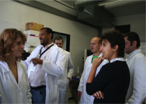 Dr. Yeshitila Degefu at work in the lab with his colleagues