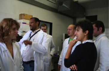 Dr. Yeshitila Degefu at work in the lab with his colleagues