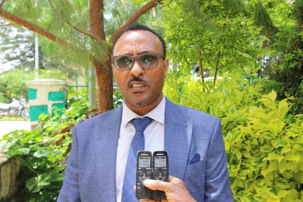 Dr. Adinew Tadese on Validation workshop on peace and development project activities image